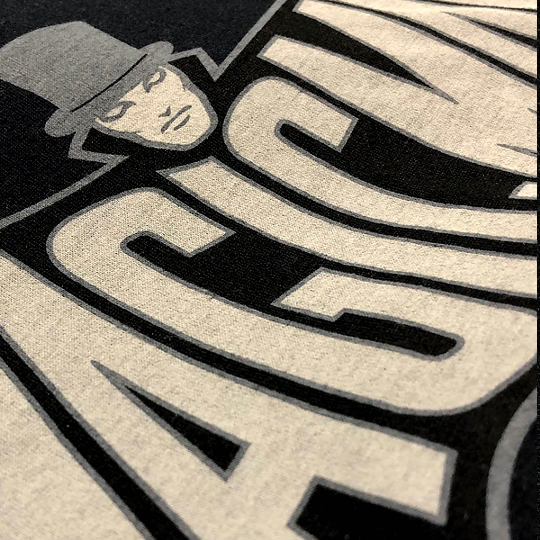 Black MagicMan Stealth Edition Vault t-shirt featuring a subtle superhero-inspired magician logo in muted cream and gray