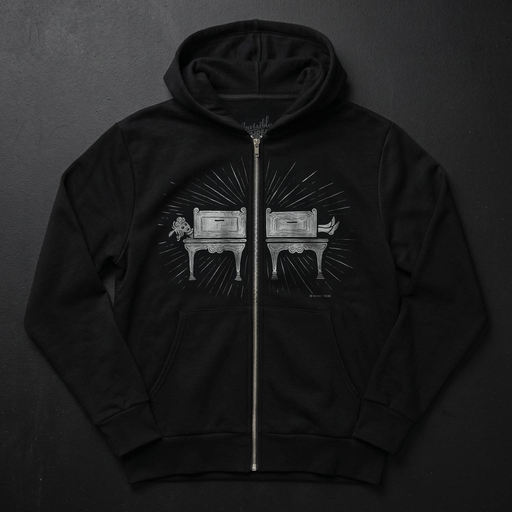 Black Saw Girl Hoodie Vault zip hoodie featuring a screen-printed vintage sawing illusion design split by the zipper