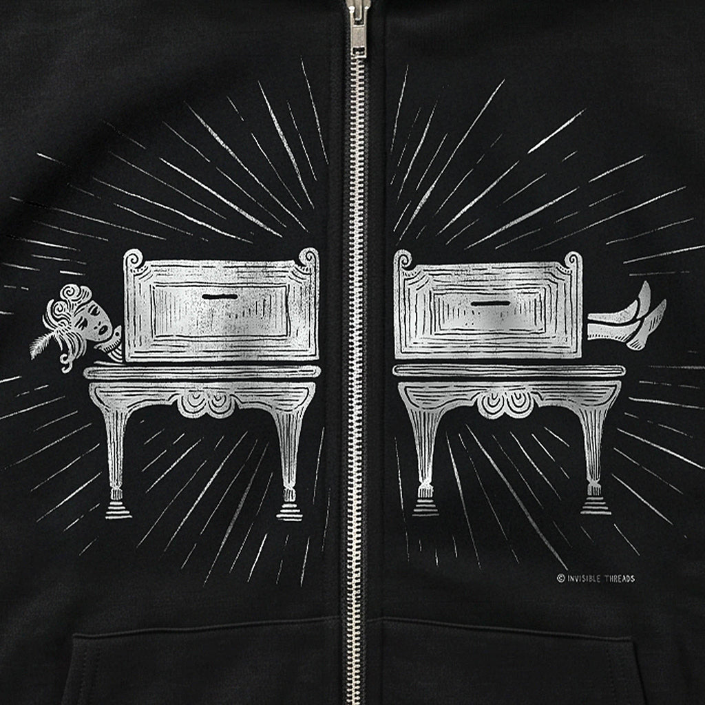 Black Saw Girl Hoodie Vault zip hoodie featuring a screen-printed vintage sawing illusion design split by the zipper